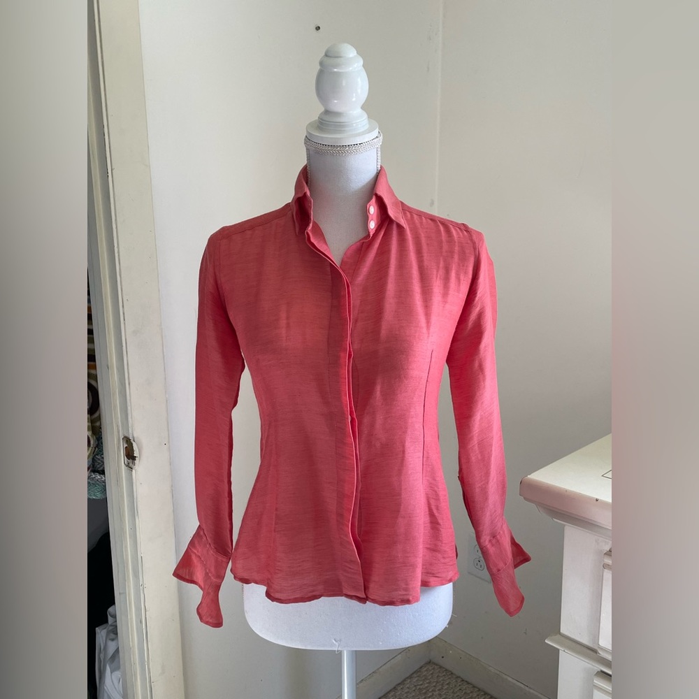 Button down with flounce sleeves. Dry-clean only. Fair condition